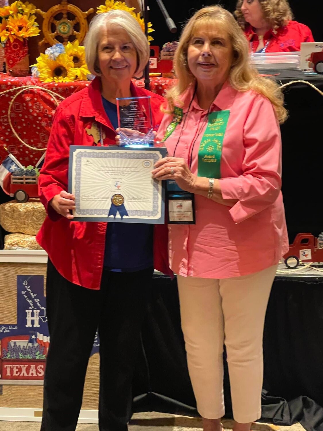 Joyce Curry, right, accepts her wards for 40 years of service to the Texas Anchor Districts of Pilot International.